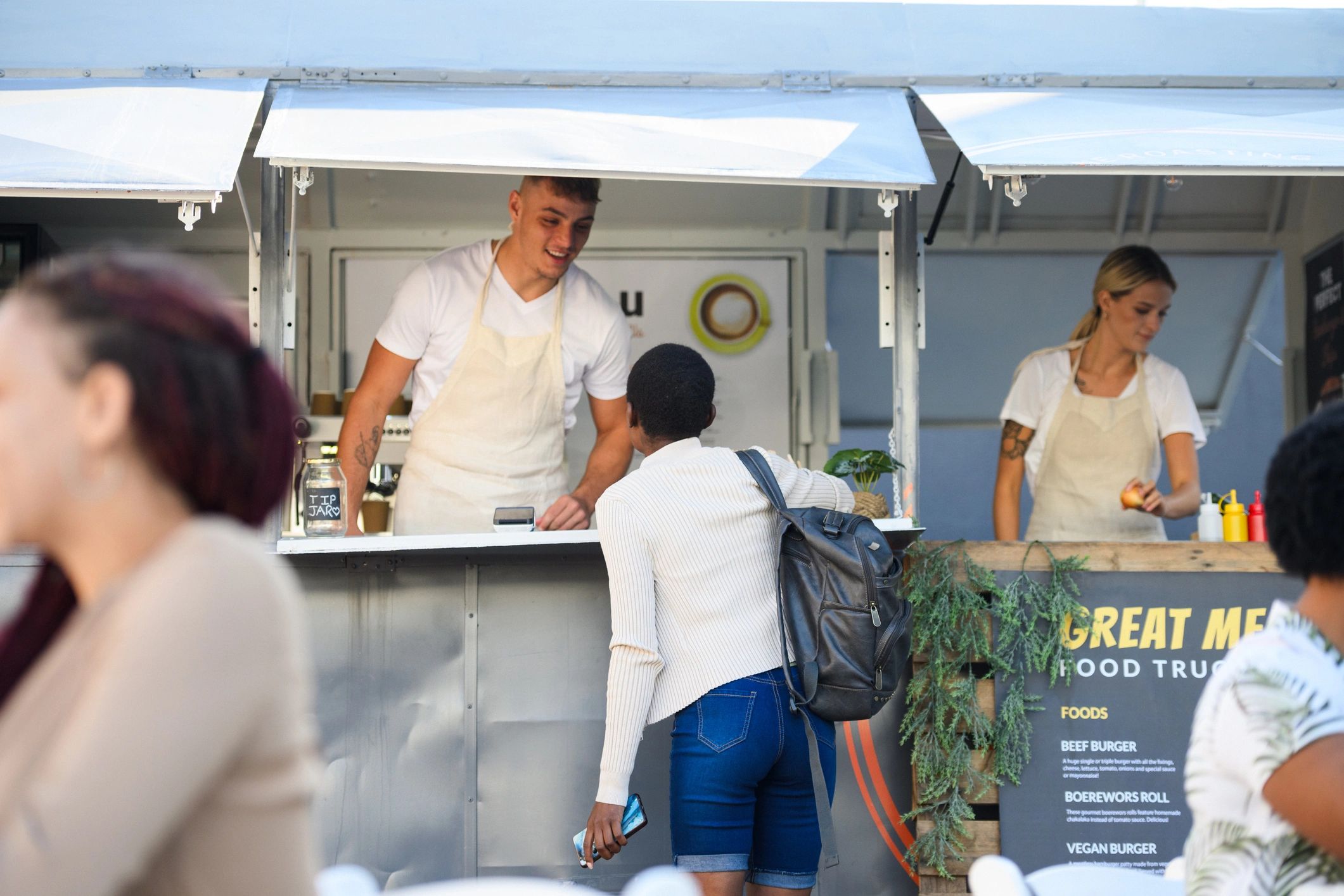 Customer ordering lunch from a mobile food truck
