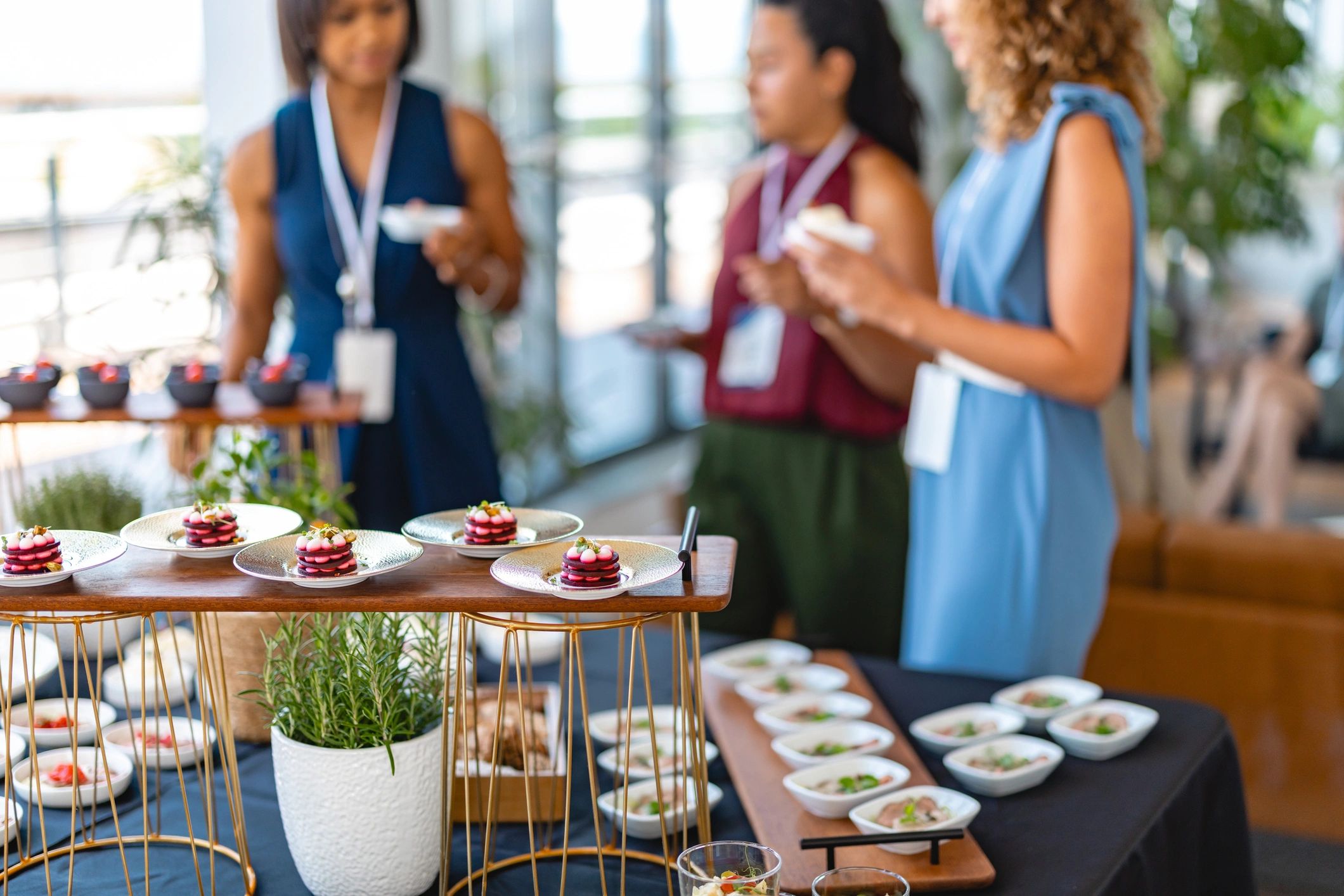 Work colleagues enjoying catered food at a business event