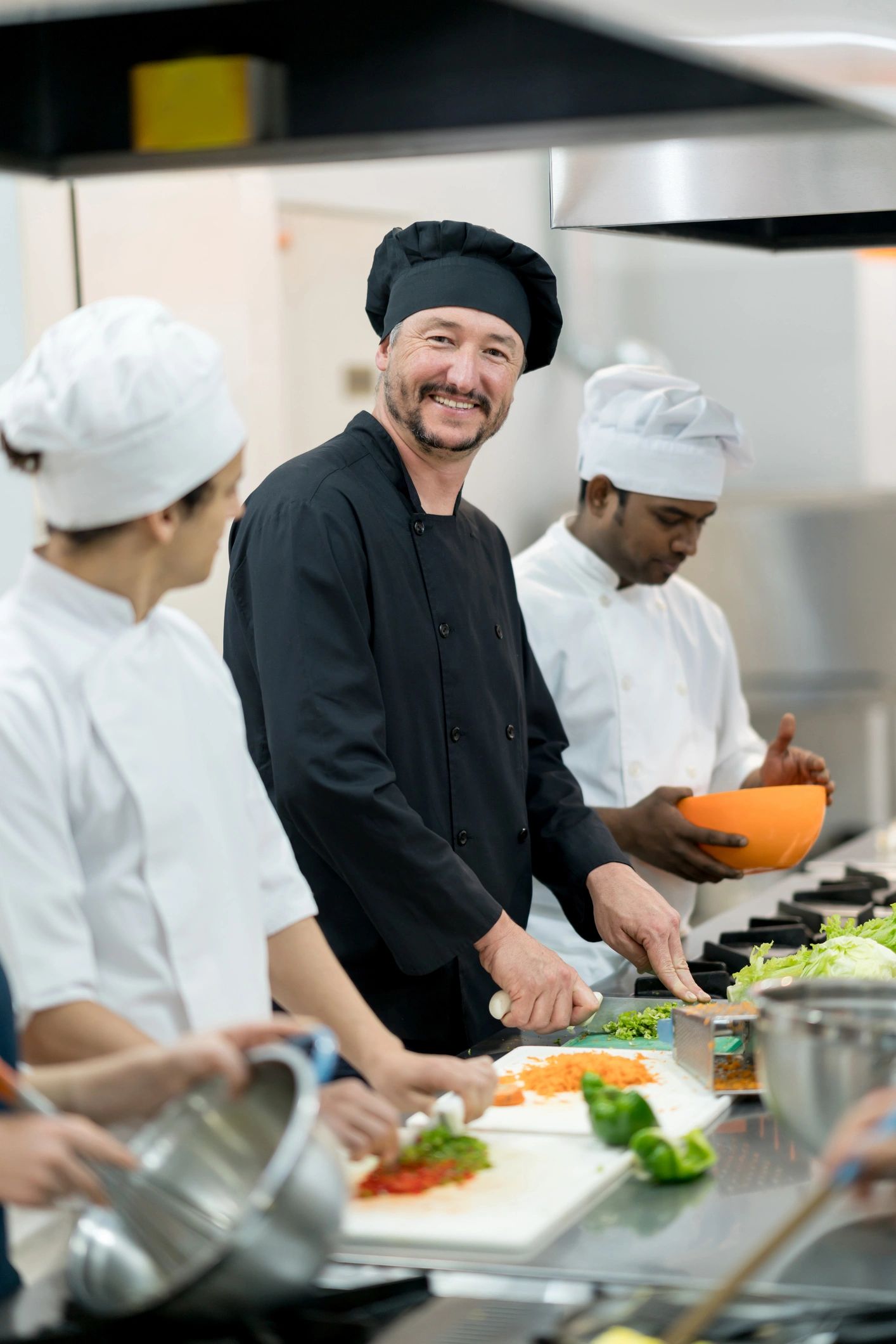 Happy catering team ready to serve